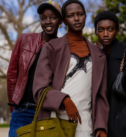 four girls wearing jackets