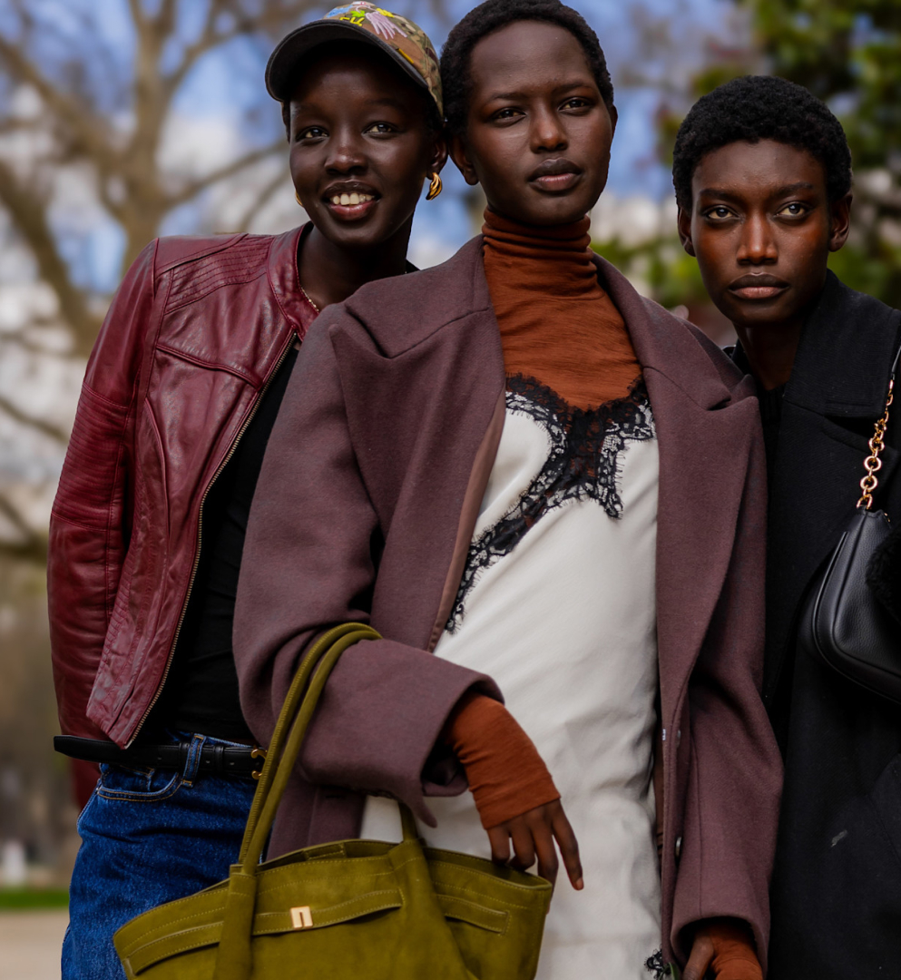 four girls wearing jackets