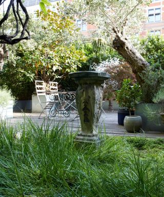 Garden Architectural Salvage, exterior space with art and table