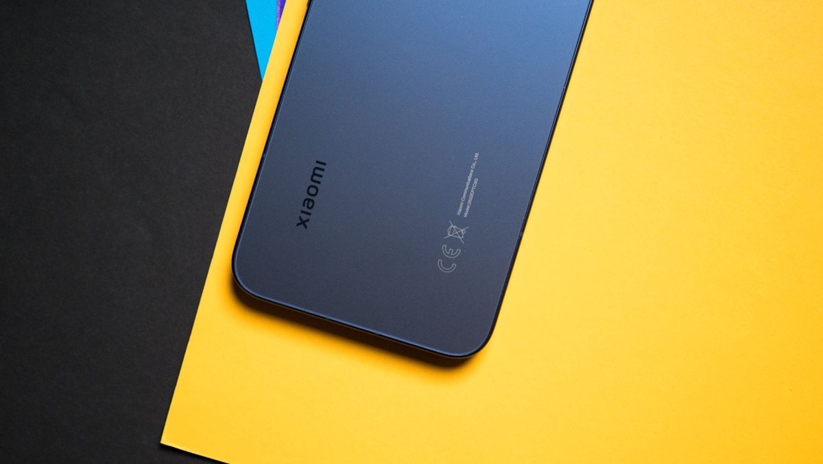 Xiaomi 17T Pro rear view against a colorful craft sheet highlighting the design