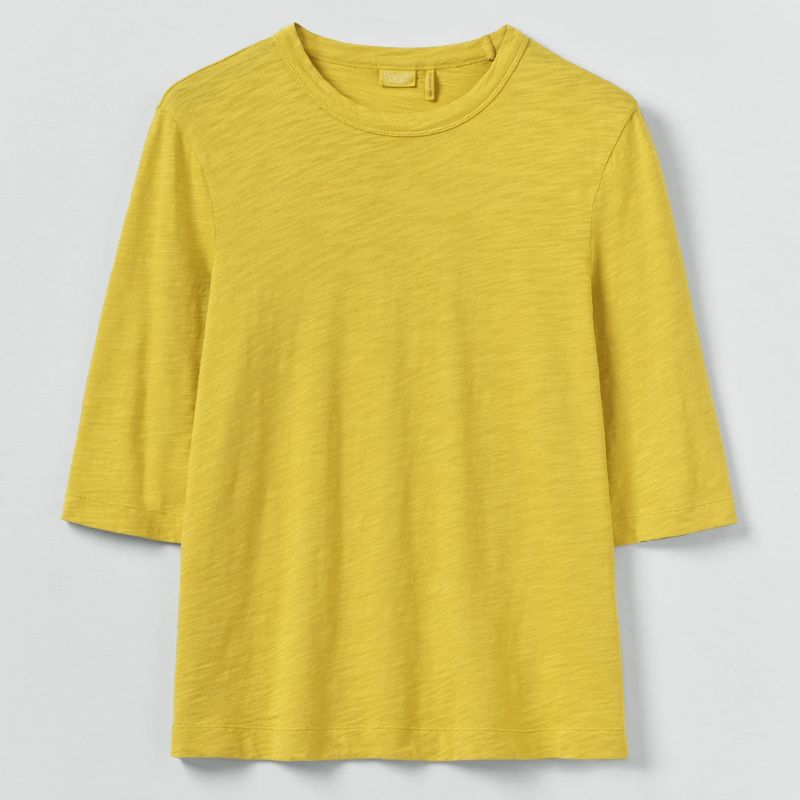 A cutout of a yellow tshirt by Toast