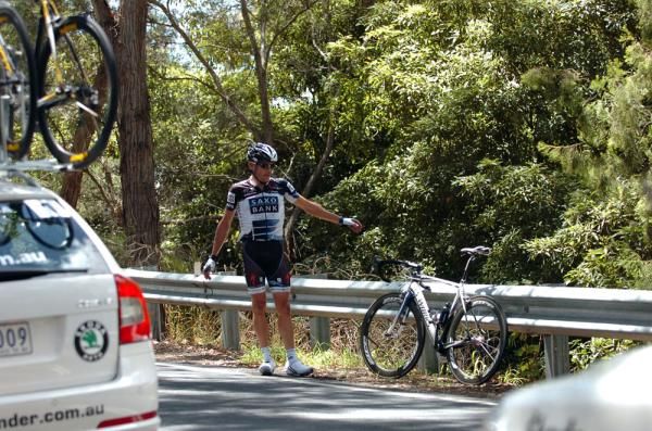 Baden Cook (Saxo Bank) waits for assistance from his team car