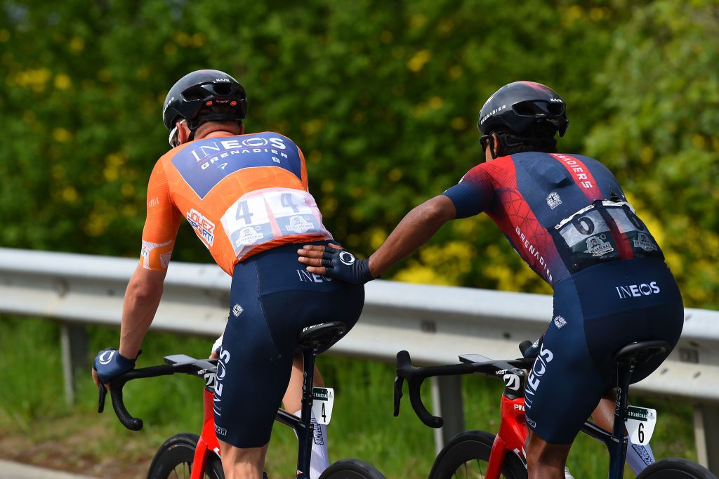 VALBROYE SWITZERLAND APRIL 29 Brandon Smith Rivera Vargas of Colombia R helps to Ethan Hayter of United Kingdom and Team INEOS Grenadiers Orange Points Jersey in a sanitary stop during the 75th Tour De Romandie 2022 Stage 3 a 1651km stage from Valbroye to Valbroye TDR2022 on April 29 2022 in Valbroyeon Switzerland Photo by Dario BelingheriGetty Images