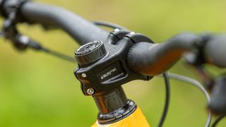 Close up of mountain bike handle bars and dropper post