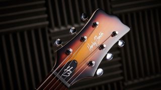 The headstock of a Harley Benton electric guitar