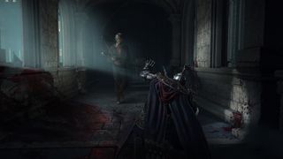 An Elden Ring player sneaks through a dark tomb