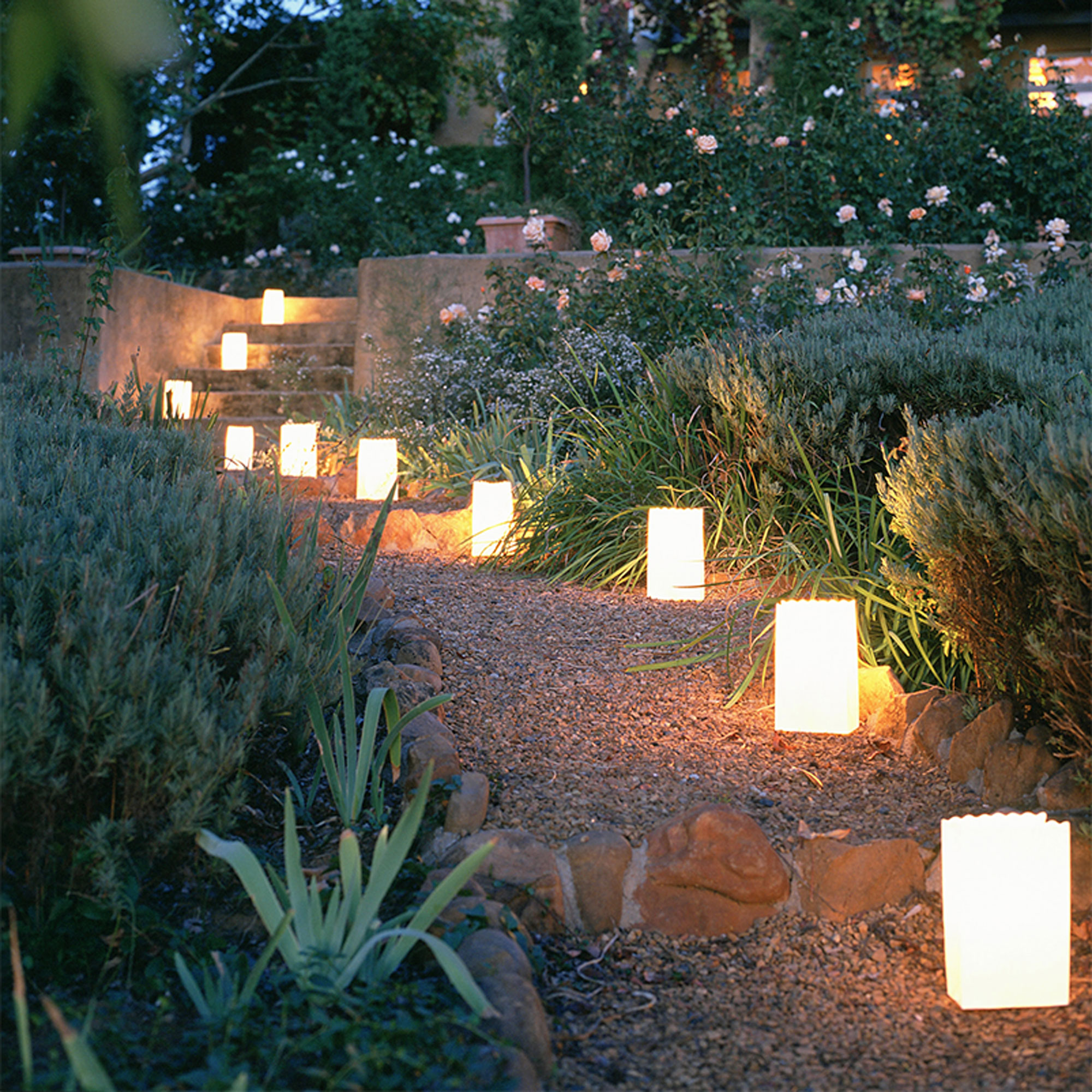 gravel garden path with candle lantern bags