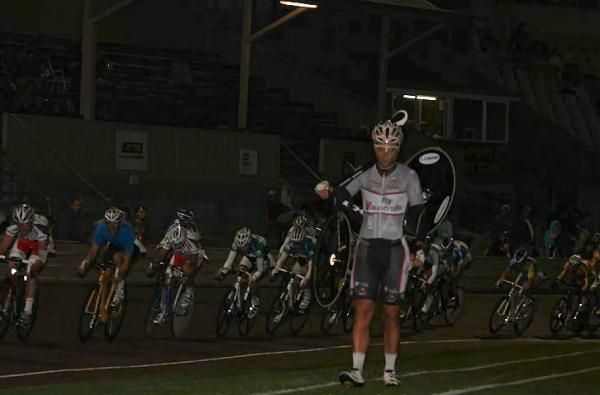Ben Kersten checks out the running track as the peloton rolls past.