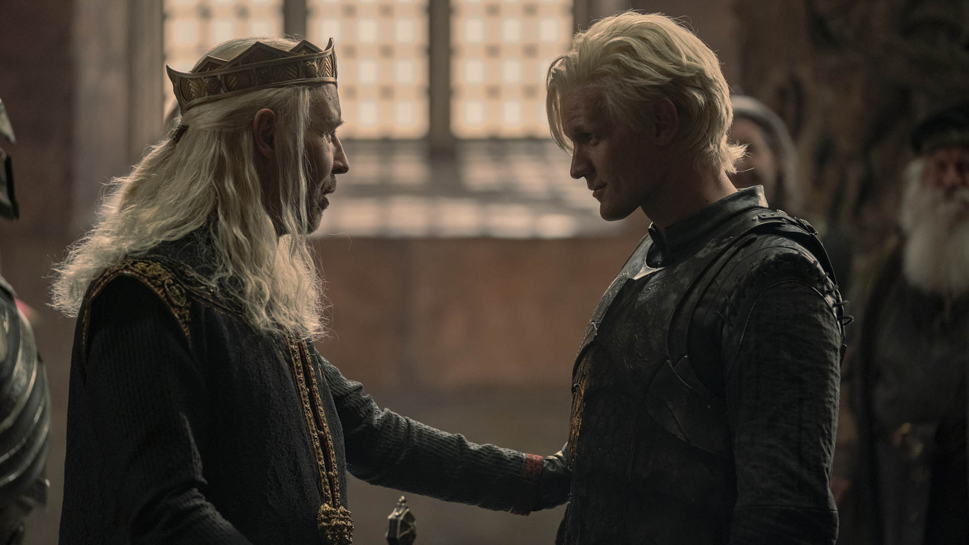 King Viserys I shares a tender moment with Prince Daemon in his throne room in House of the Dragon episode 4