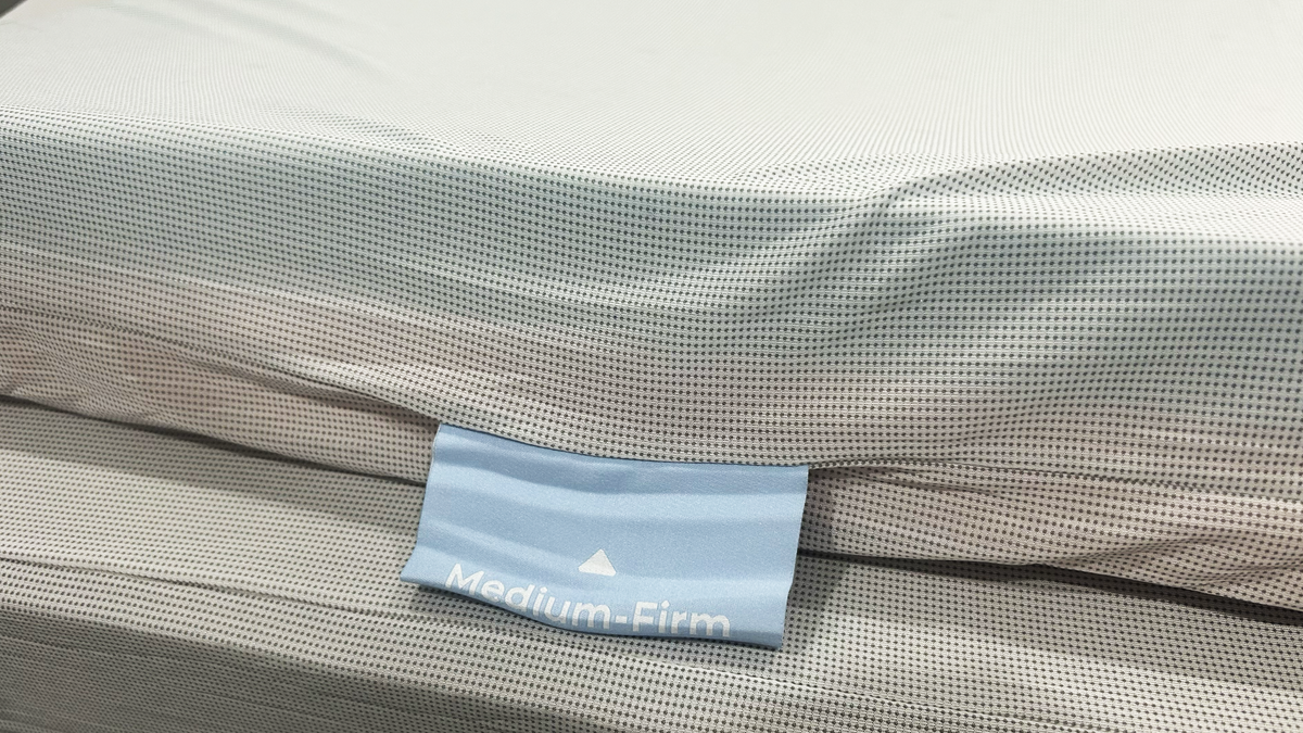 Medium firm tag on mesh liner of mattress