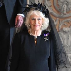 Queen Camilla wearing a black veil and black dress