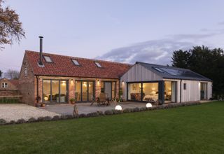 outdoor lighting to illuminate a barn conversion and extension