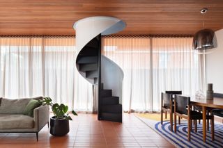 A staircase in the middle of the living room