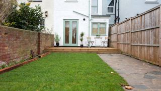 small garden with fence and wall