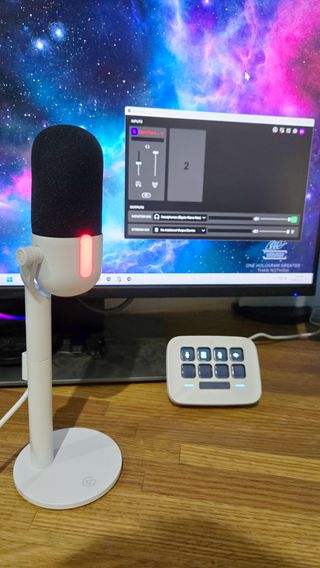 Elgato Wave Neo microphone set-up on a desk, with cables.