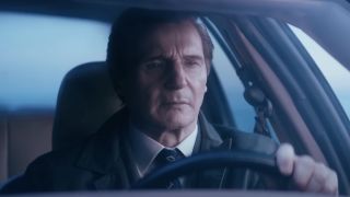 Liam Neeson's Frank Drebin Jr. driving in The Naked Gun