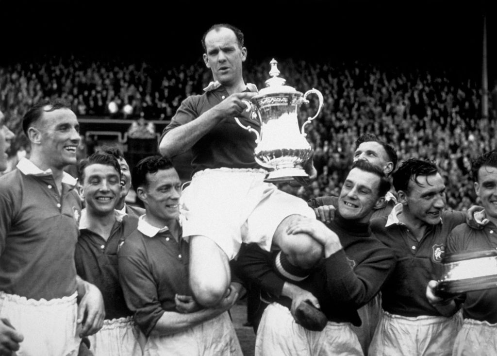 24th April 1948: Manchester United captain Johnny Carey is carried shoulder high after his team beat Blackpool 4-2 in the FA Cup final at Wembley Stadium, London. (Photo by William Vanderson/Fox Photos/Getty Images)