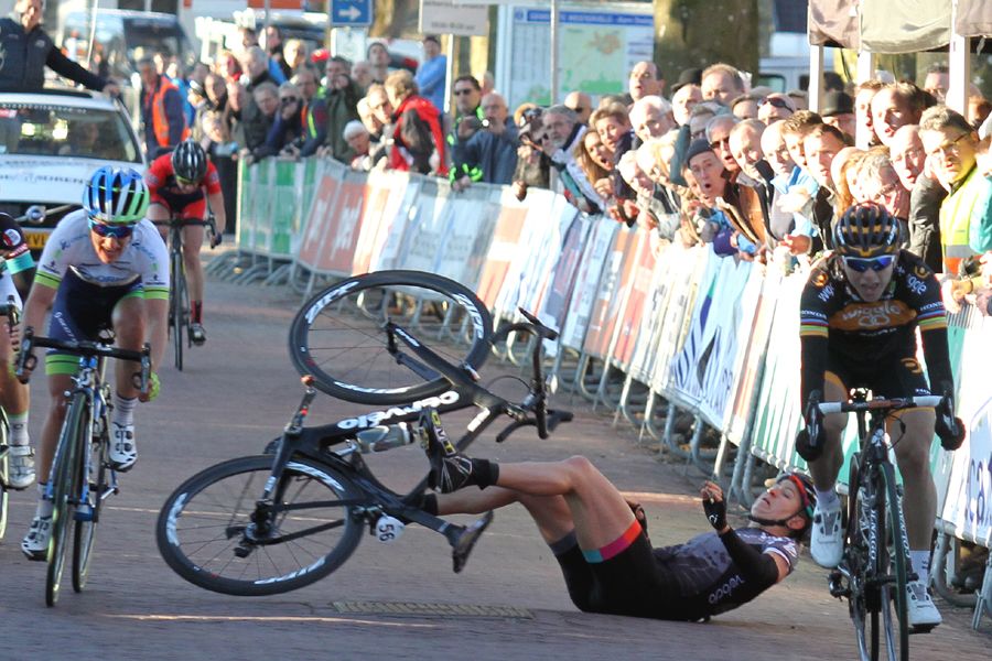Loren Rowney (Velocio-SRAM) hits the ground after the spectator grabbed her bars