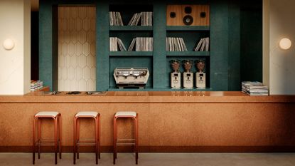 Listening bar with burl wood bar, teal cupboards and teak bar stools
