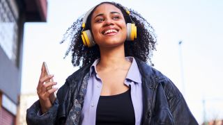 Woman listening to music outdoors