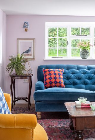 colorful living room in a cottage in Kent with printed cushions