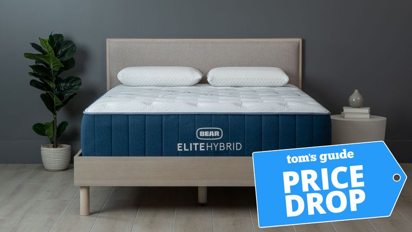 The Bear Elite Hybrid cooling mattress on a bed frame in a bedroom, a Tom&#039;s Guide price drop deals graphic in the bottom right corner