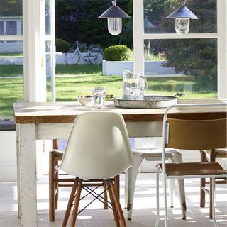 dining area with white flooring and dining set