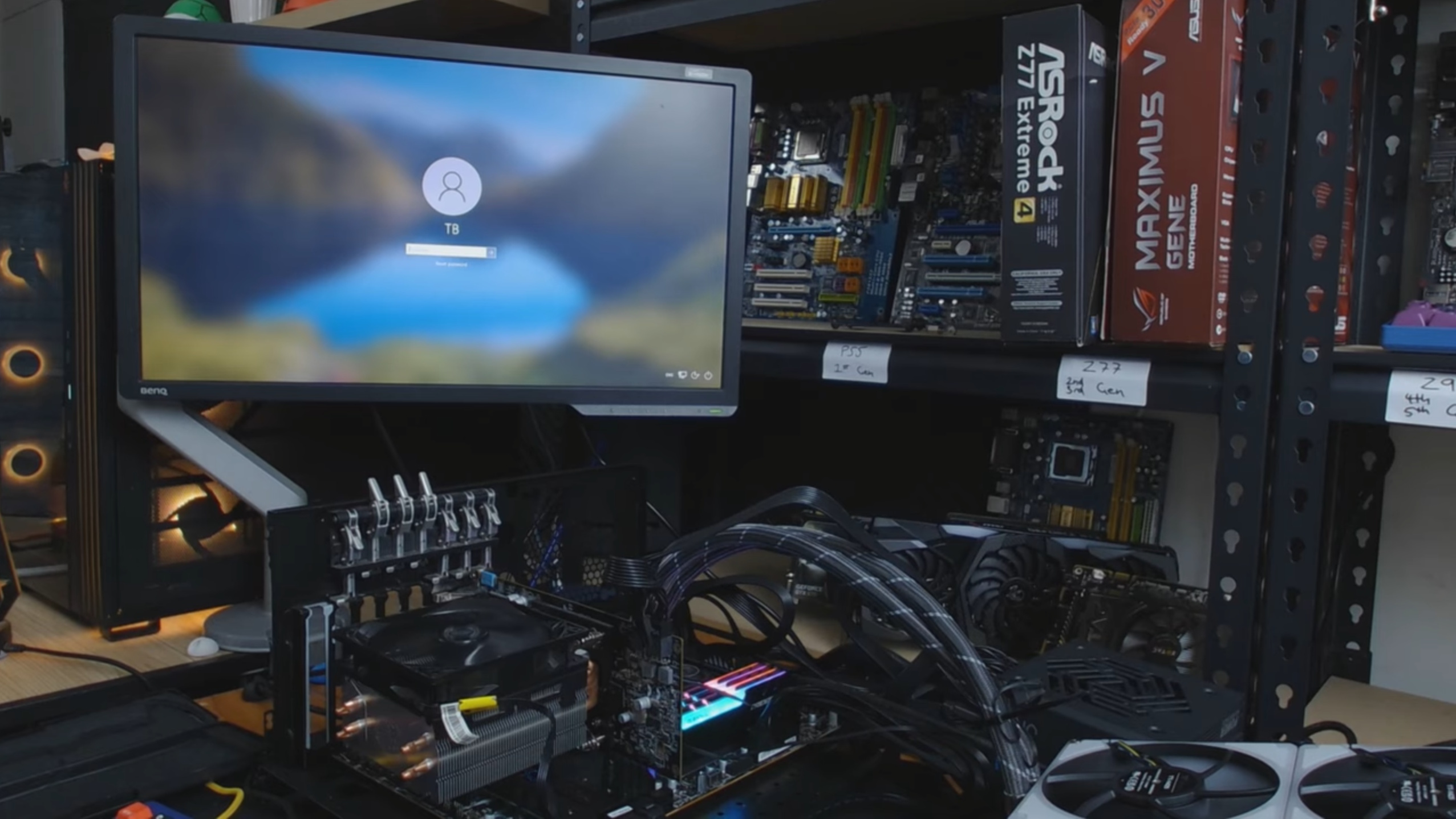 a CPU cooler on a graphics card in a test bench in front of a computer screen