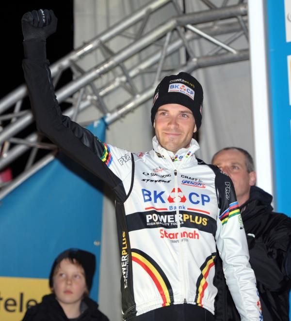 Albert waves to the crowd from the podium