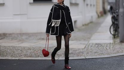 woman wearing valentine's day outfit - alaia bag and alohas shoes from the article