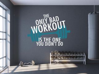 home gym with inspirational quote on the wall