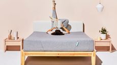 A woman reading a book on the on Siena Memory Foam Mattress (one of the best mattresses in realhomes.com buying guide)
