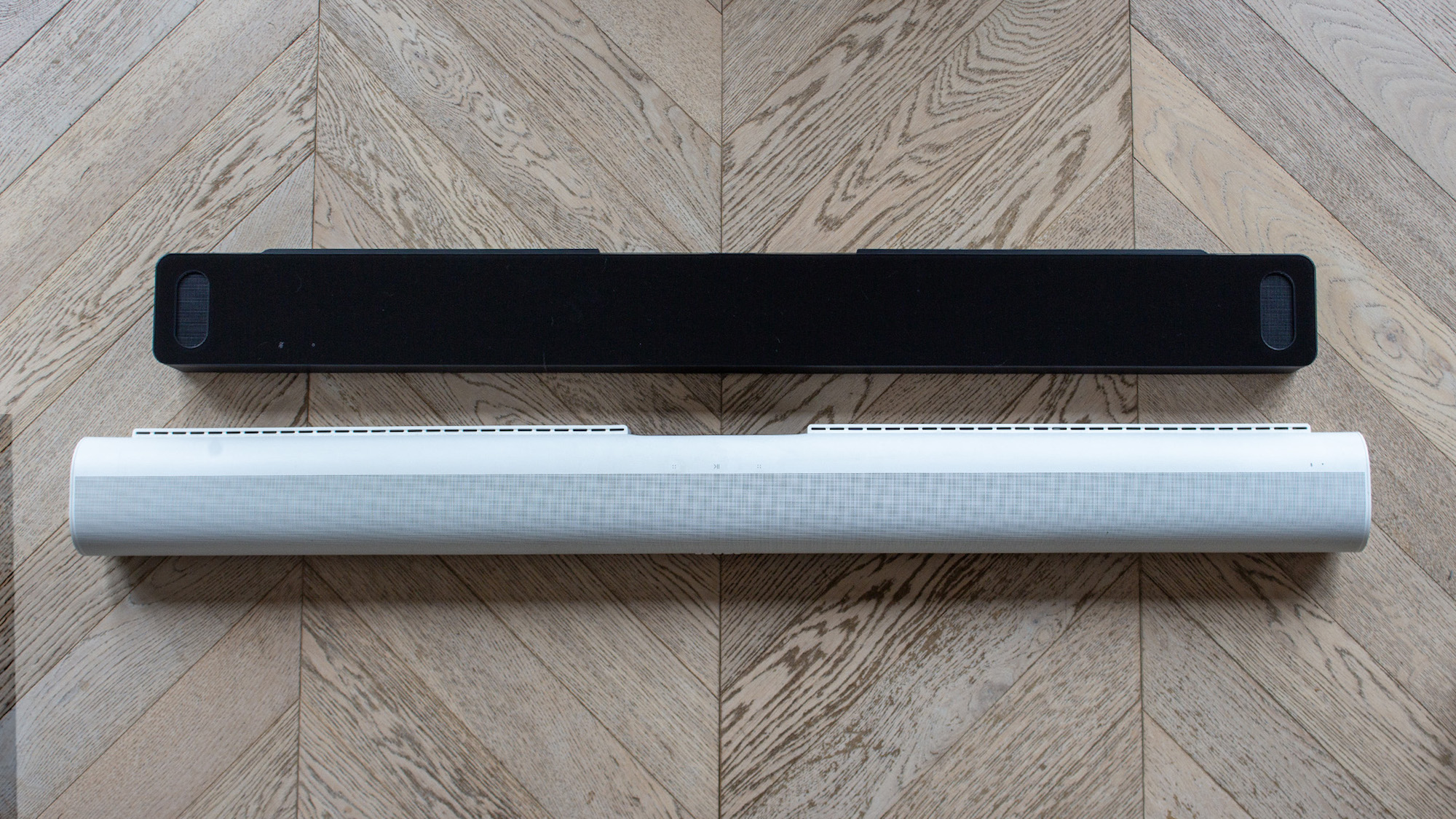 A side-by-side view of the Bose Smart Ultra Soundbar and the Sonos Arc.