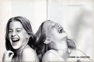 two young girls laughing in black and white