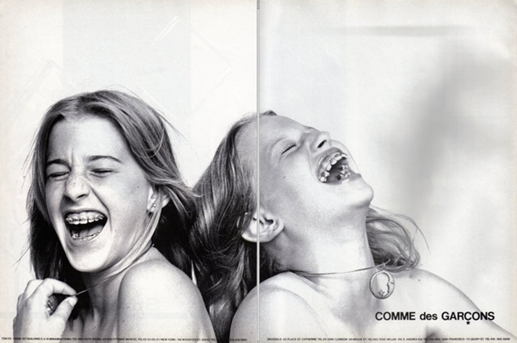 two young girls laughing in black and white