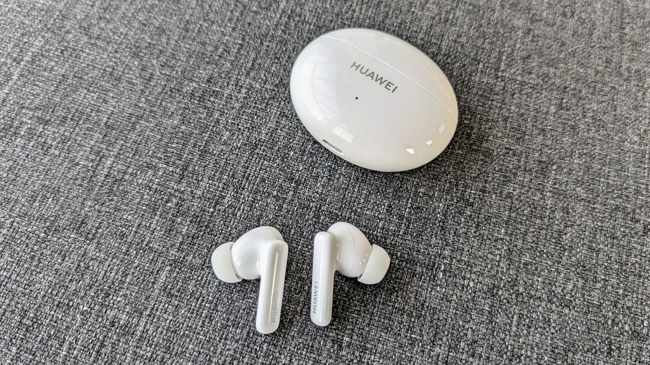 Huawei Freebuds 5i review: earbuds out of their case on grey cushion