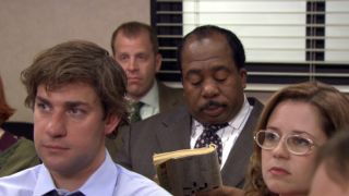 Stanley doing his crossword puzzle in The Office