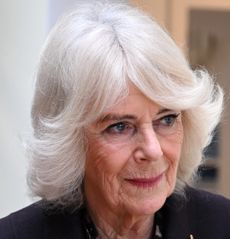 Queen Camilla wearing a dark jacket visiting the Asian Women's Resource Centre on February 20, 2025 