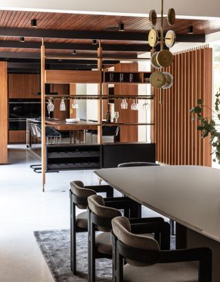 kitchen and dining area at cove way, a midcentury home restored by Sophie goineau