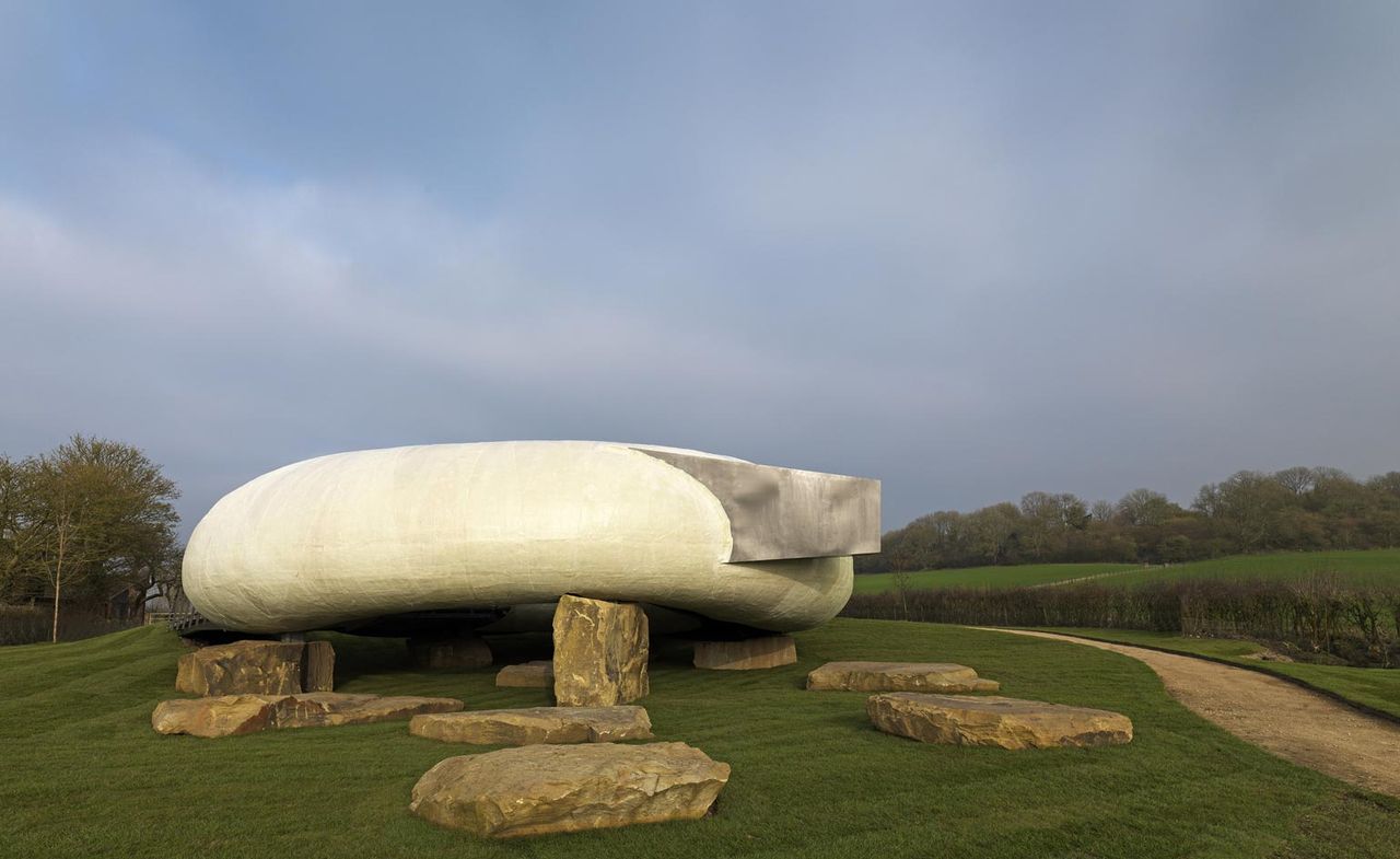 Rock feature in green field