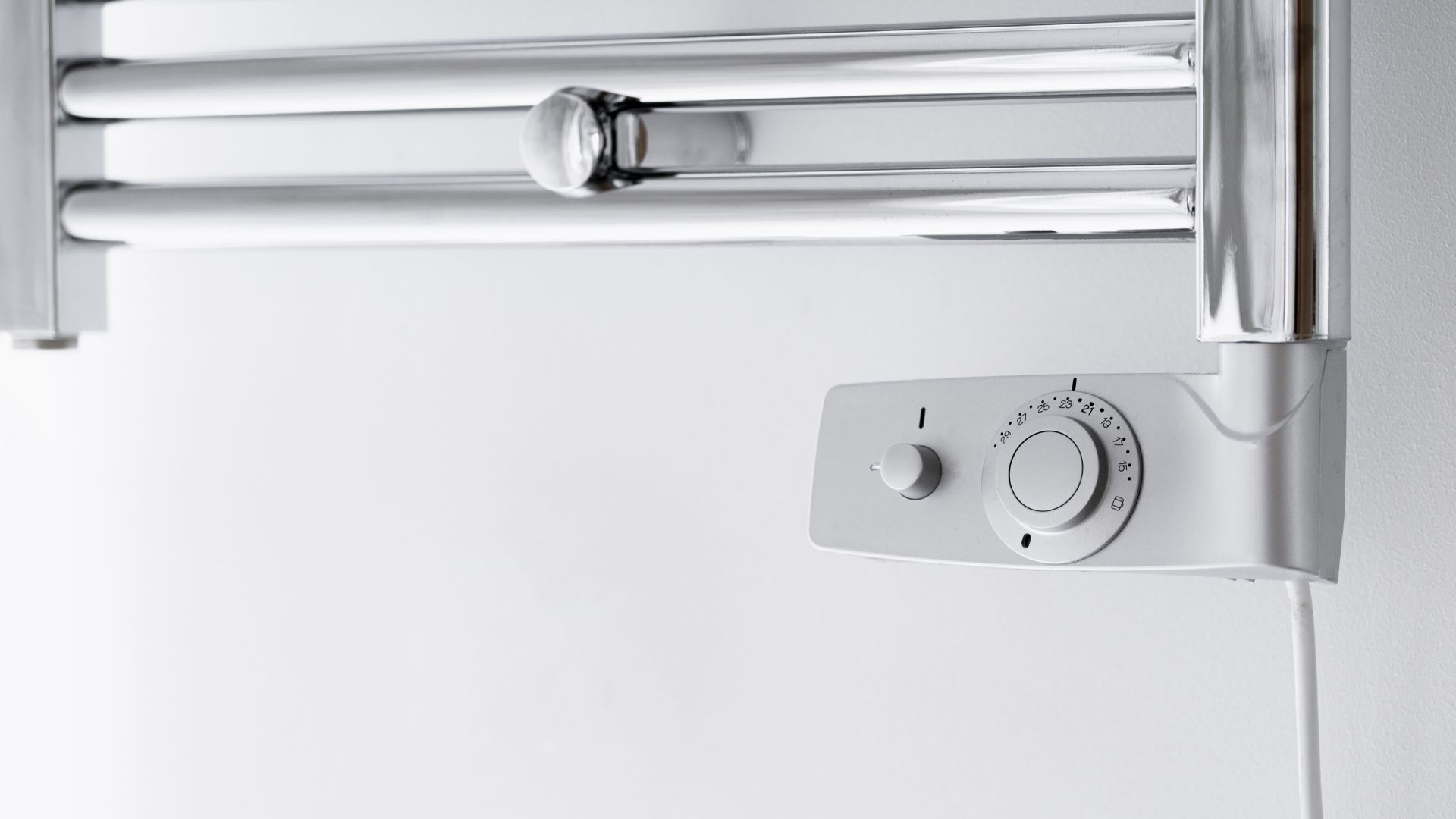 picture of electric towel rail in bathroom with thermostat