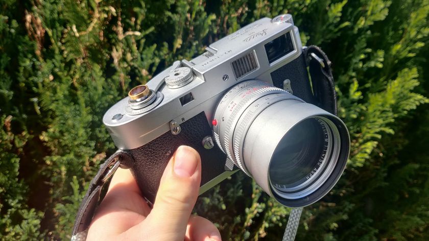 Leica M2 being held in someone&#039;s hand outdoors