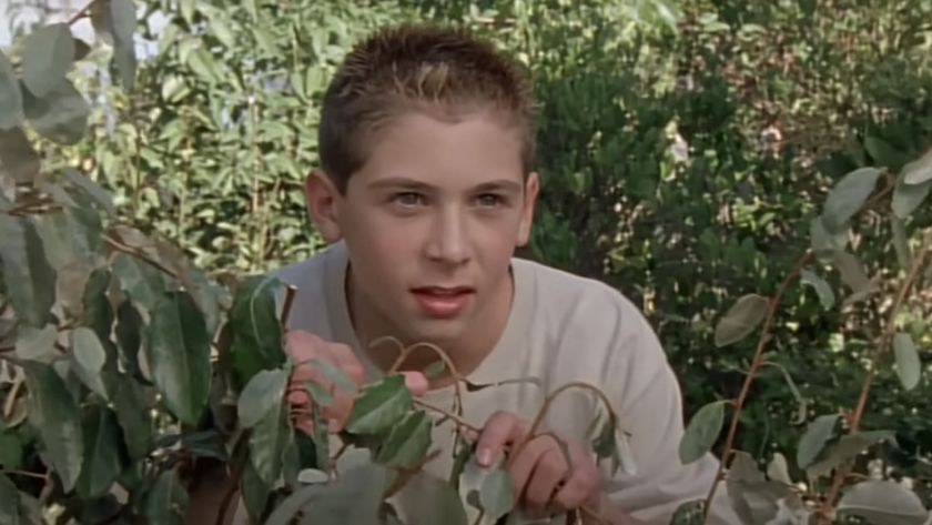 Justin Berfield as Reese hiding in bushes on Malcolm in the Middle