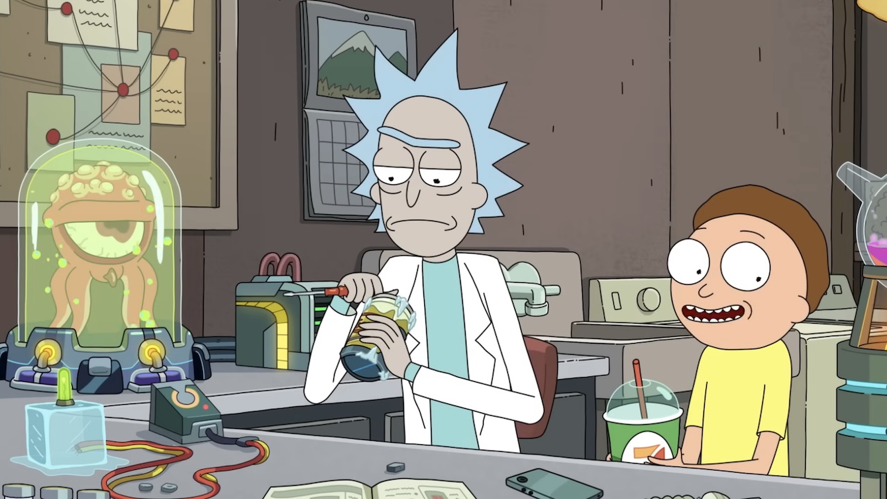 Rick working on beer can device in garage lab while Morty is smiling and drinking a Slurpee in Rick and Morty Season 9 premiere