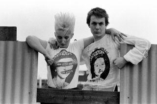 Clothing from the Seditionaries boutique on King's Road, London, 18th May 1977. Pamela Rooke (1955 - 2022), aka Jordan, and Simon Barker, aka Six, are modelling Sex Pistols 'God Save The Queen' T-shirts. Seditionaries, formerly known as Sex, is run by Vivienne Westwood and Malcolm McLaren.