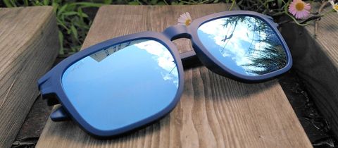 SunGod Tokas sunglasses folded on wooden bench