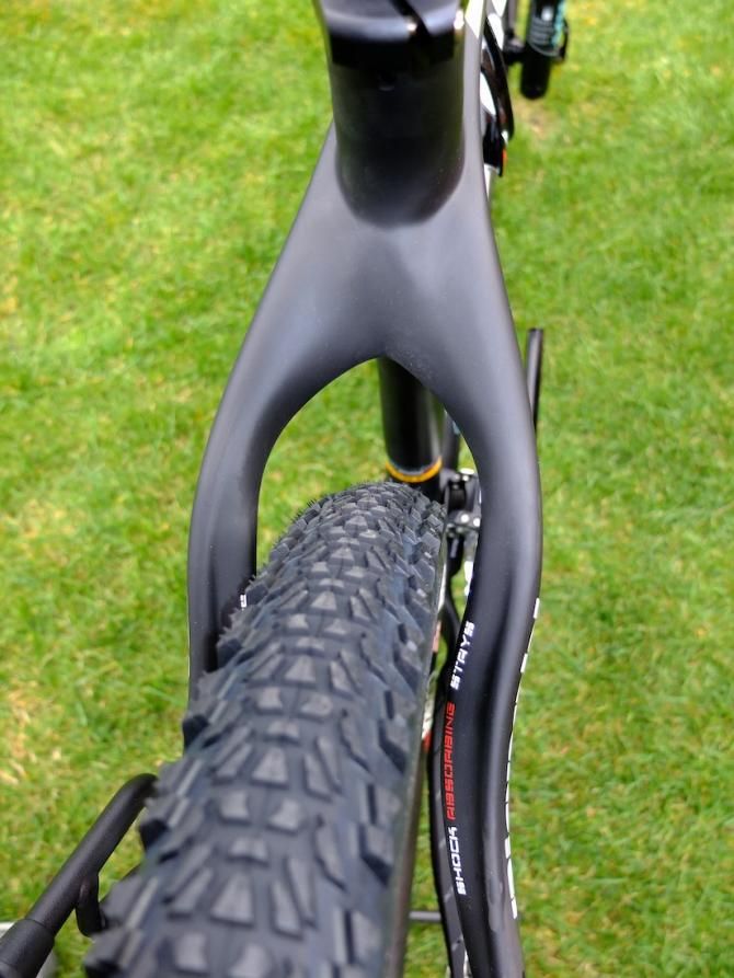 Curvy S-shaped shock absorbing seat stays