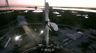 A SpaceX Falcon 9 rocket stands poised to launch the Italian CSG-2 satellite from Cape Canaveral Space Force Station on Jan. 30, 2022. The attempt was foiled by a cruise liner that wandered into the "no-go zone" downrange and couldn't be cleared in time.