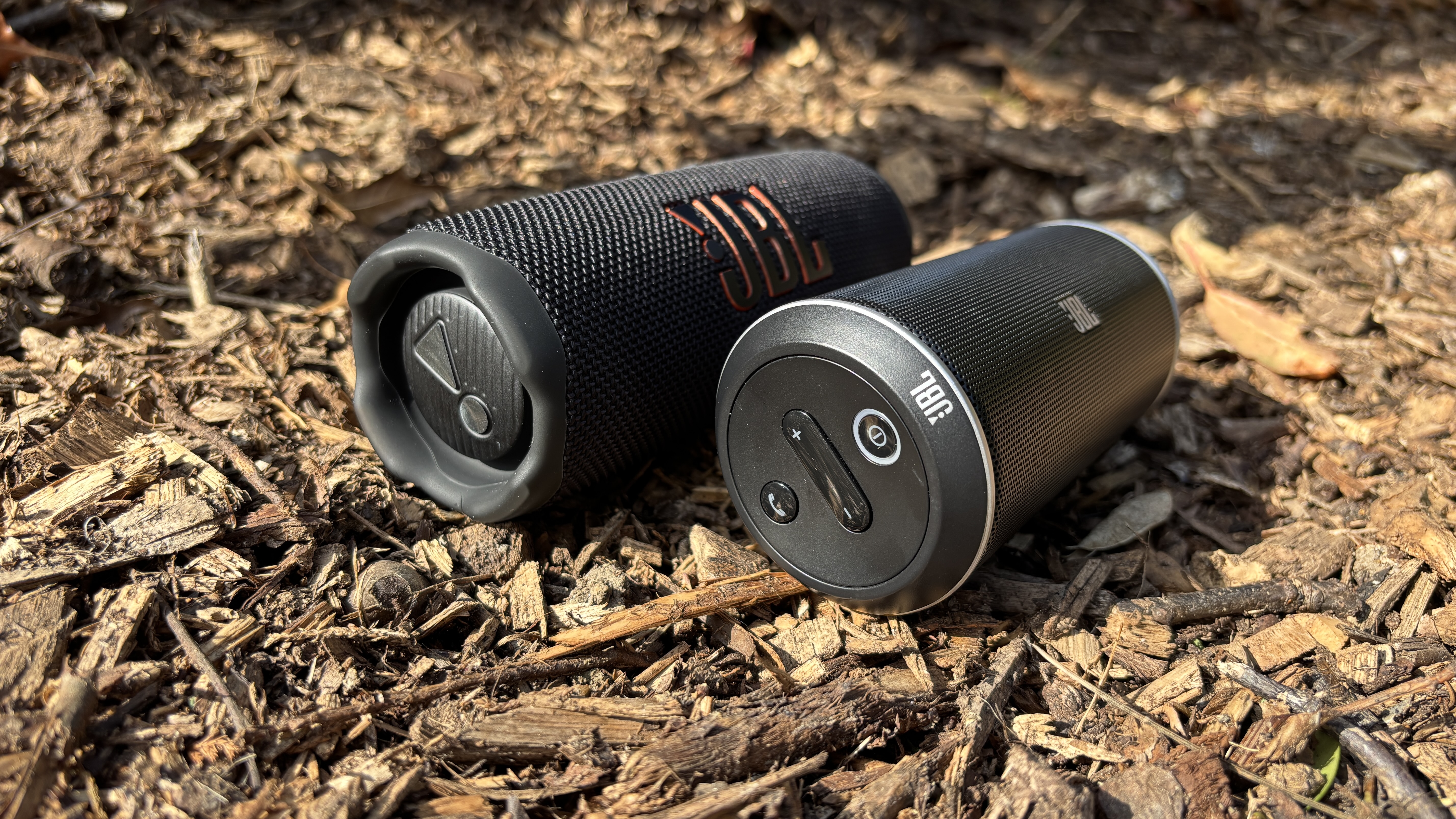 JBL Flip 7 next to the original Flip lying on the ground at an angle
