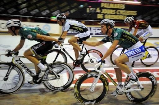 Morgan Kneisky, left, gets a hand-sling from partner Iljo Keisse.